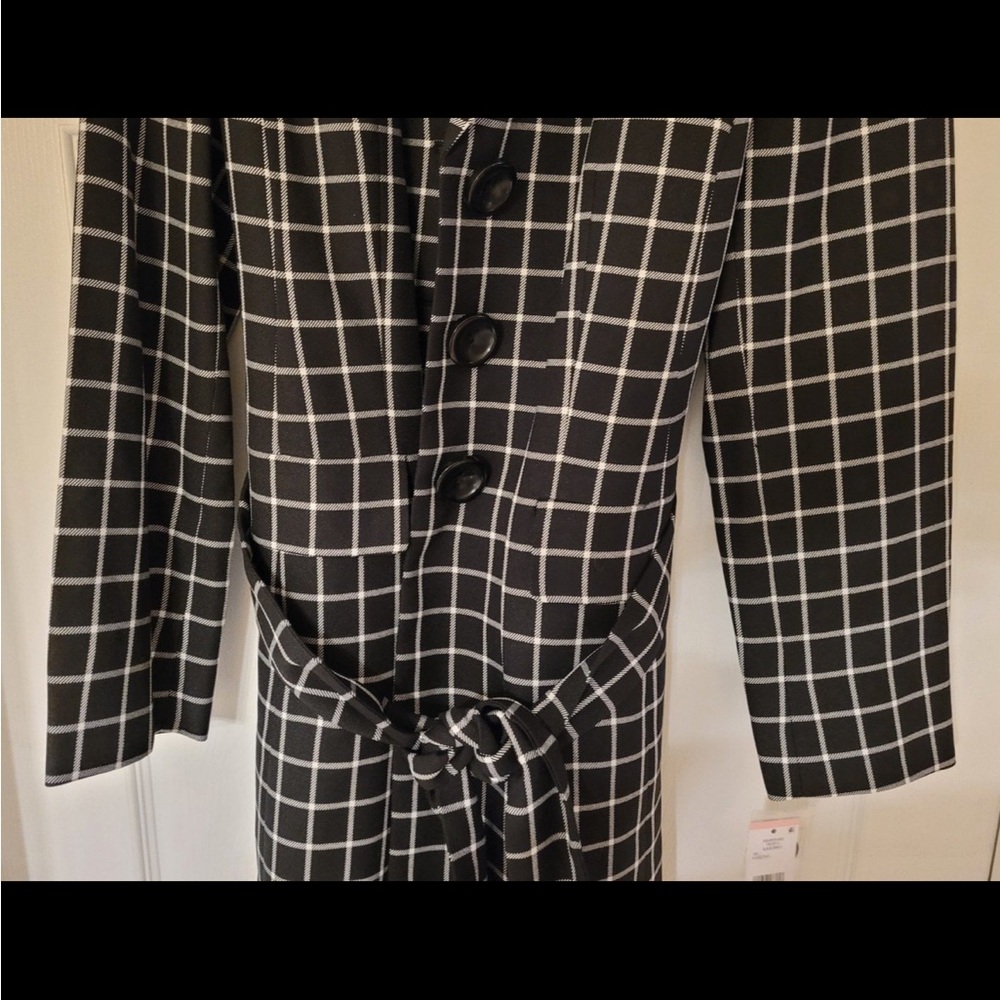 Le Suit. It can be used as a jacket or a long suite coat. INever worn.